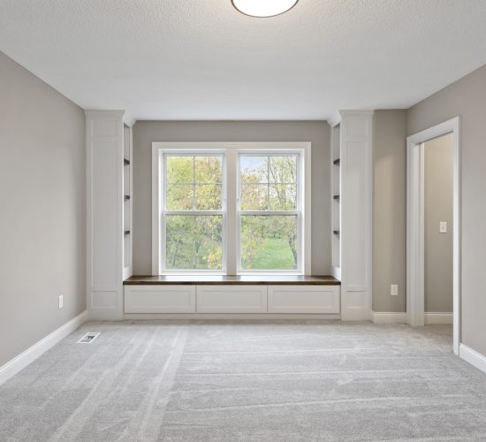 Bedroom with builtins and window seat