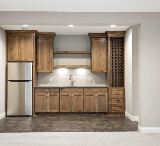 Downstairs bar with wood cabinets