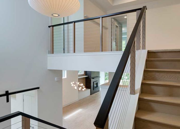 Staircase with unique railing and lighting