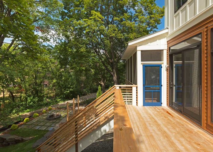 Back yard deck with blue accent door and saturated wood