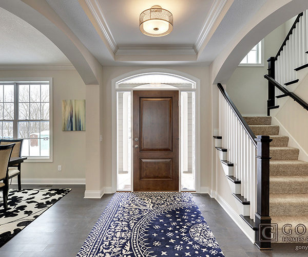 Front entry of home with unique rug