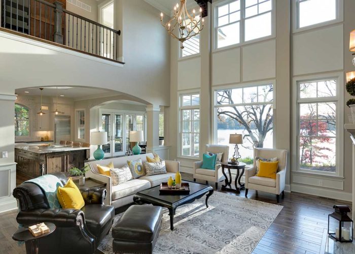 Large living space with high ceilings and windows
