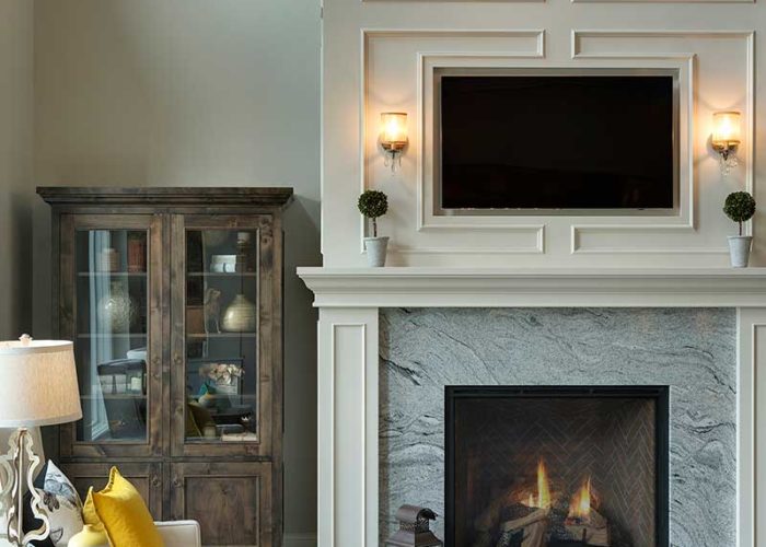 Modern marble fireplace with television in living area