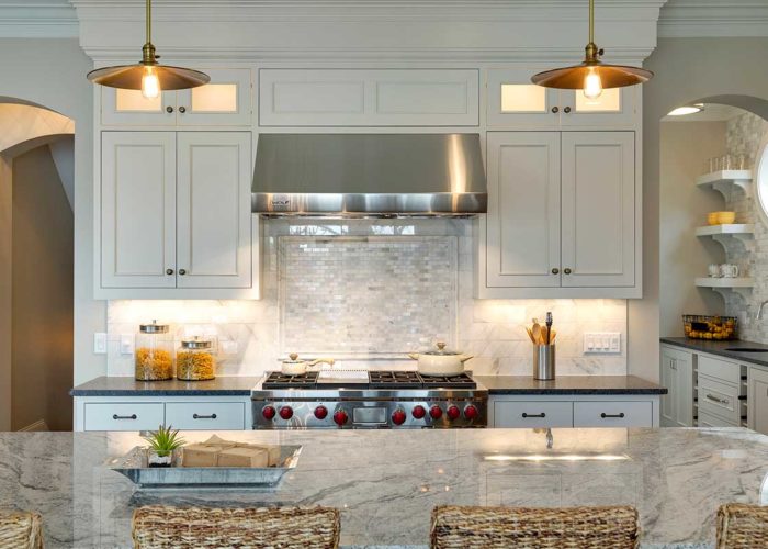 Kitchen details with white cabinets and pendant lighting