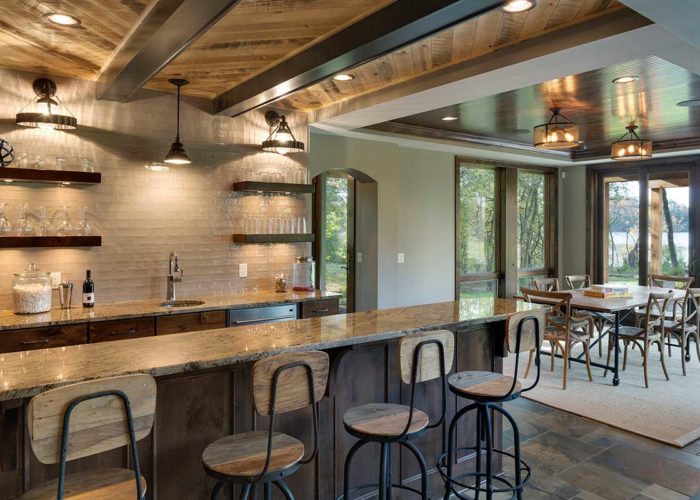 Rustic basement bar area with table