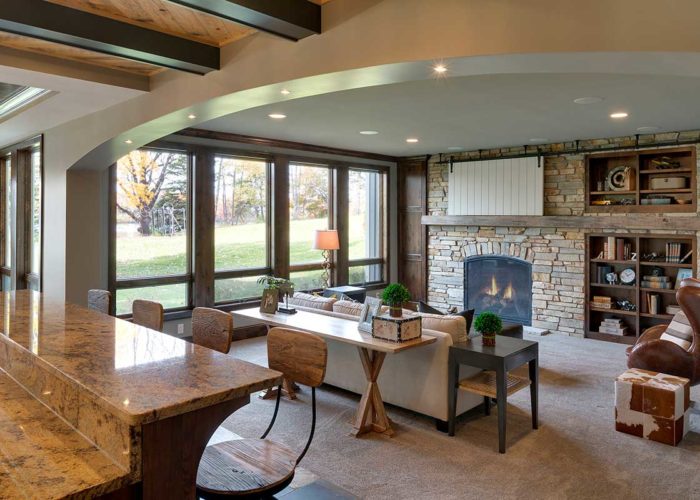 Large living space with built in shelving and fire place