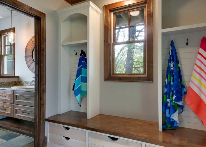 Rustic mudroom with white accent cabinets