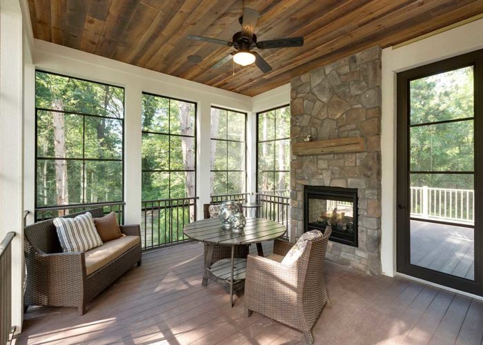 Seasonal porch with stone fire place