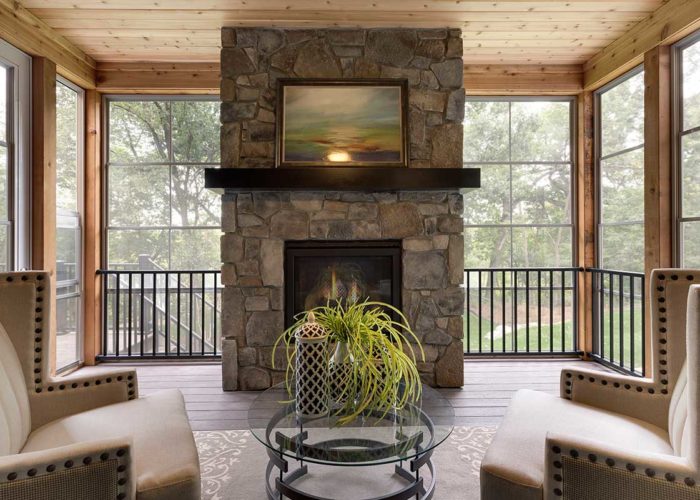 Seasonal patio with stone fire place and seating