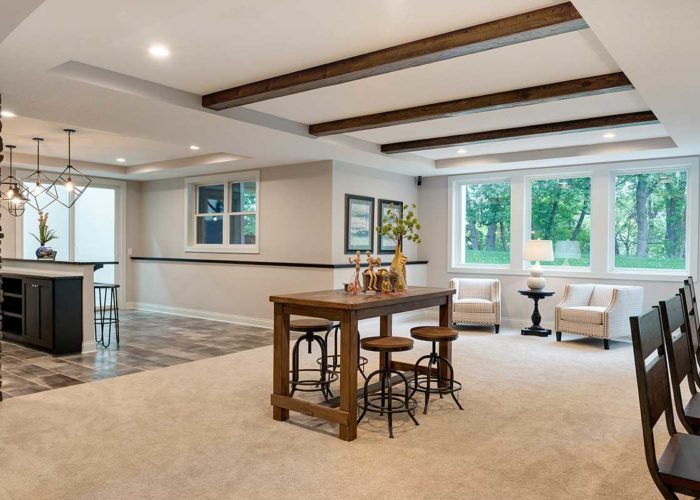 Exposed beam ceiling and seating in basement