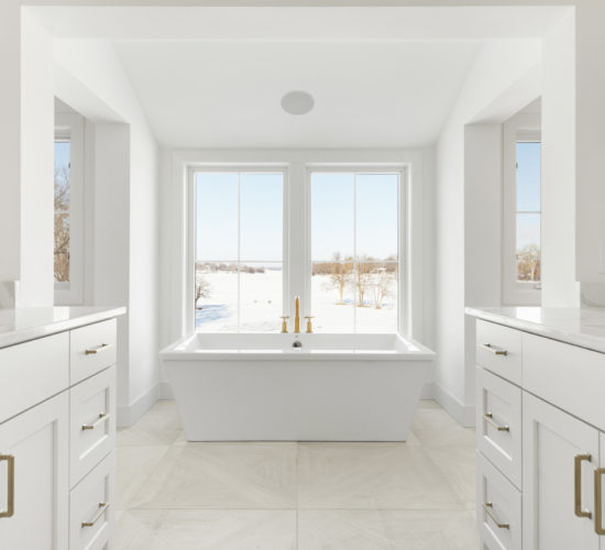 owners bath with large soaking tub and windows