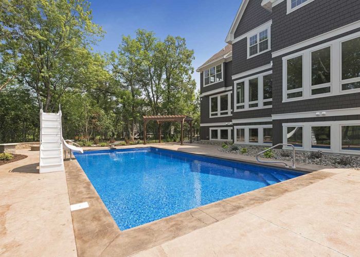 Exterior of back of home with backyard pool