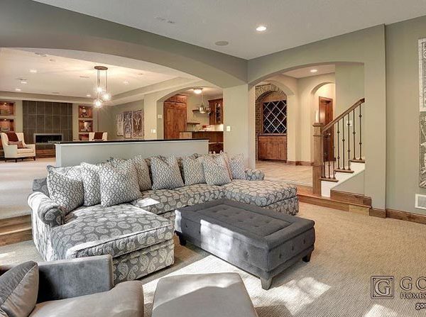 Lower level living space with grey and wood accents