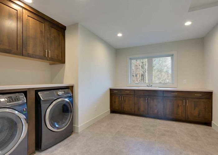 Large laundry room with sink and counter space