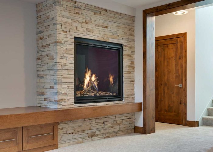 Large fire place with stacked stone