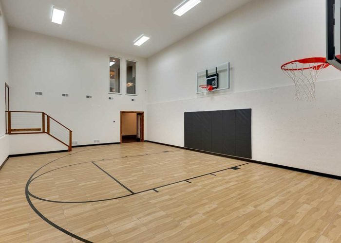 Indoor sportcourt with two basketball hoops