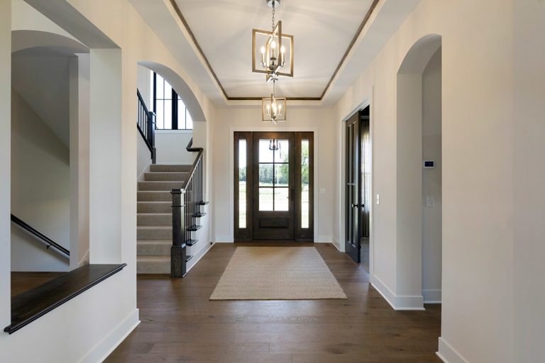 Home entry with arches and unique lighting