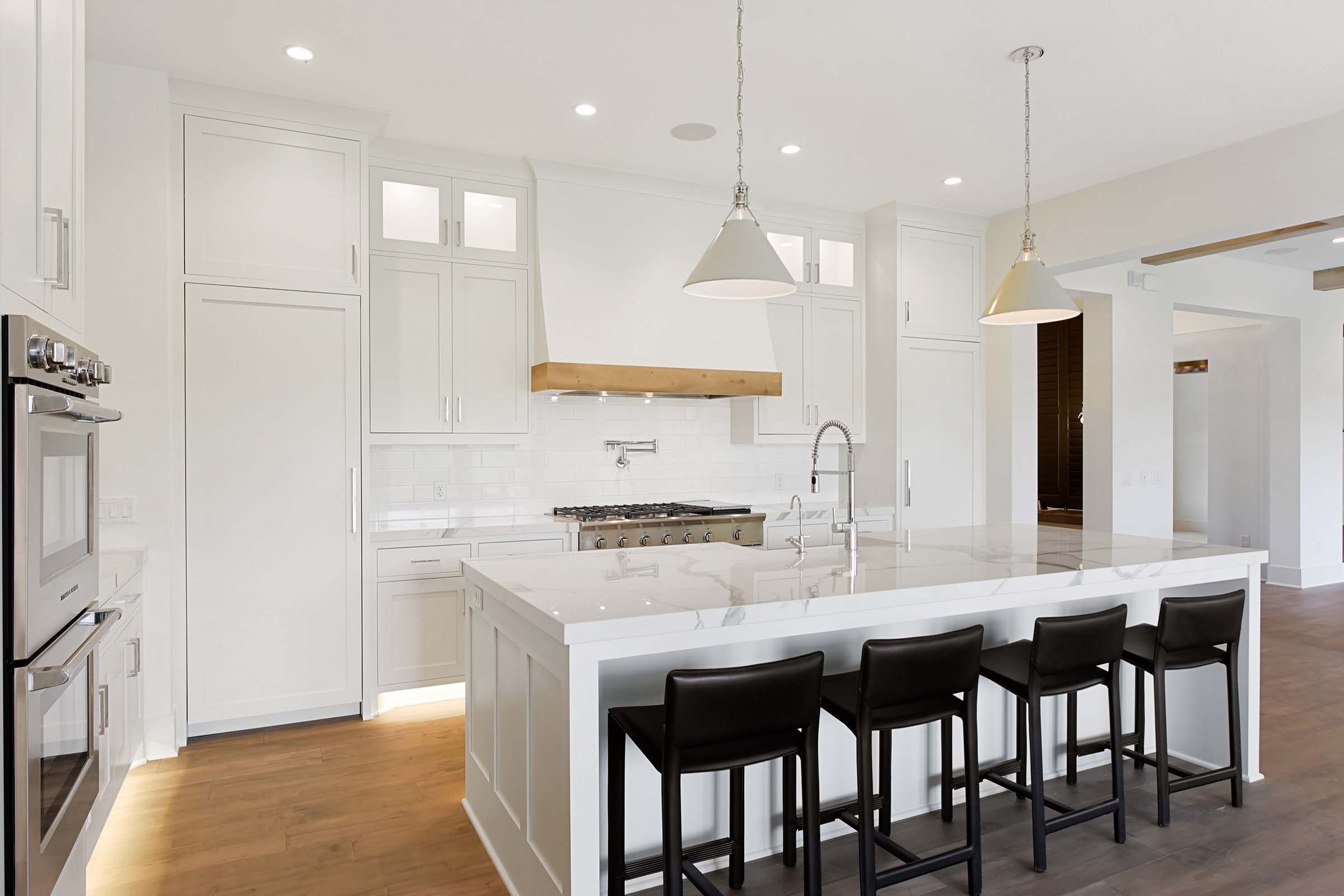 White contemporary kitchen with under cabinet ligting