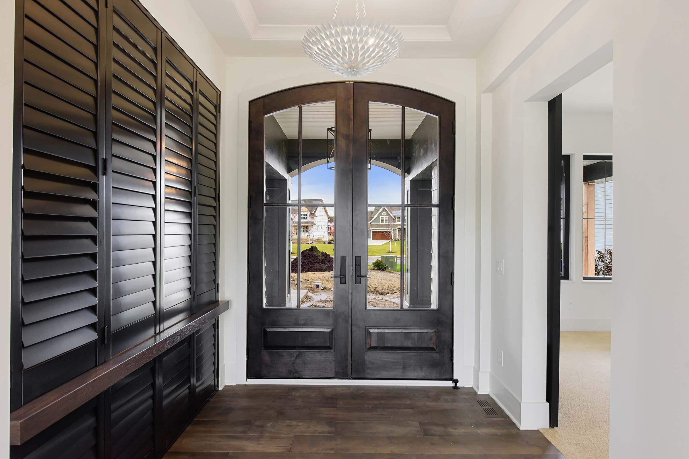 dark wood front door foyer and closet Gonyea Homes