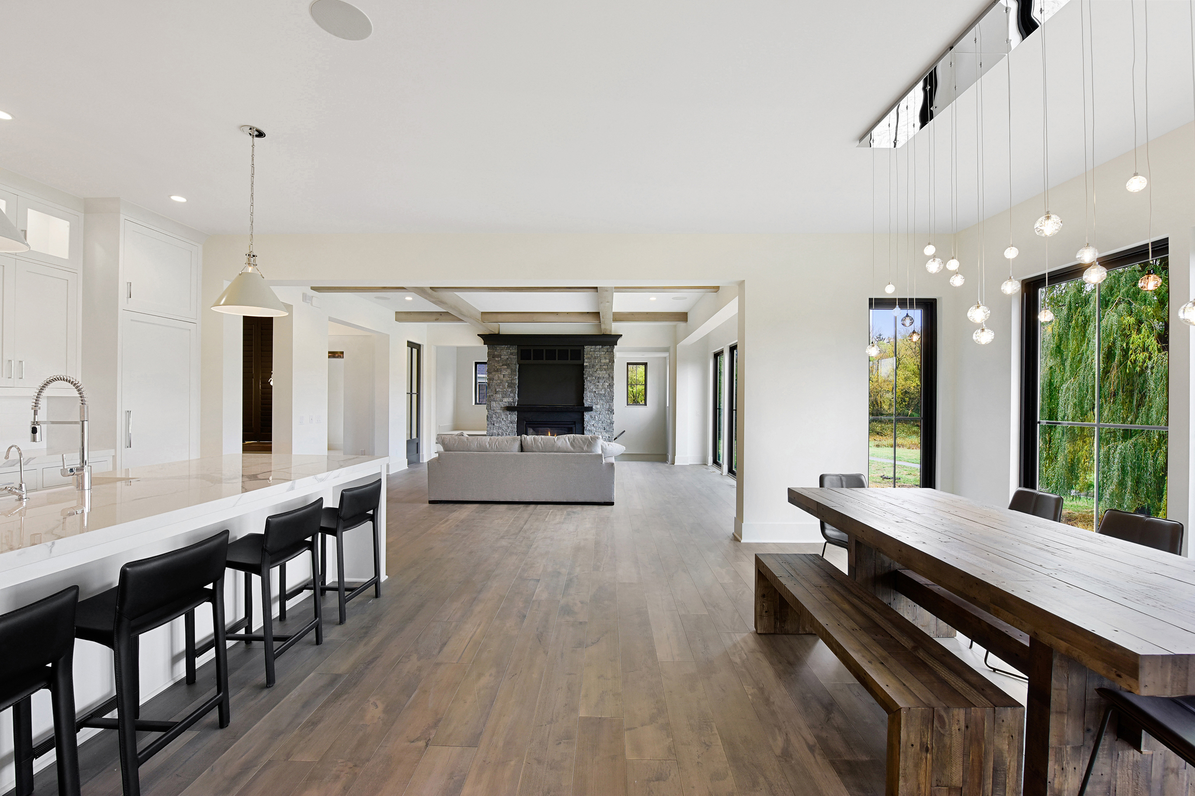 Shorewood Gonyea Custom home main level kitchen dinette and stone fireplace