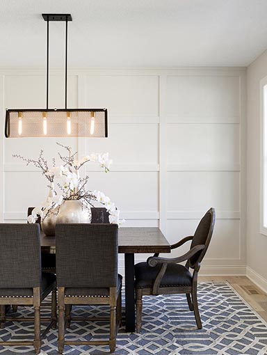 Modern dining room with white panel wall