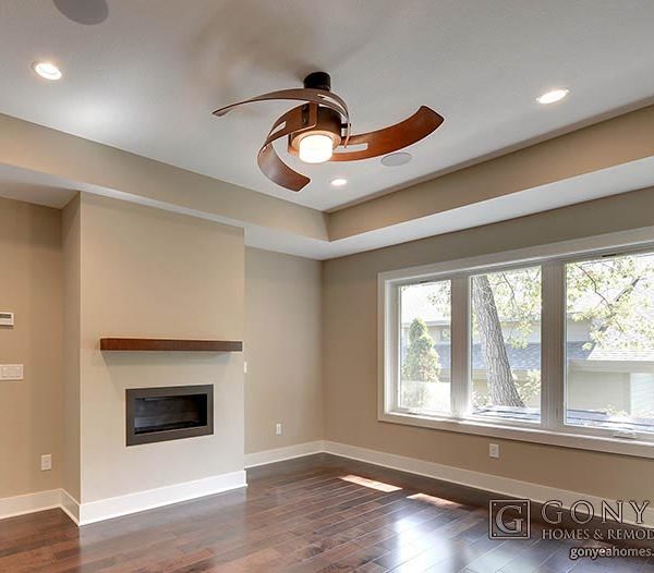 Contemporary box vault ceiling with unique ceiling fan