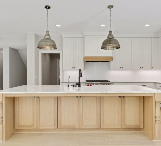 kitchen with white cabinets and wood island