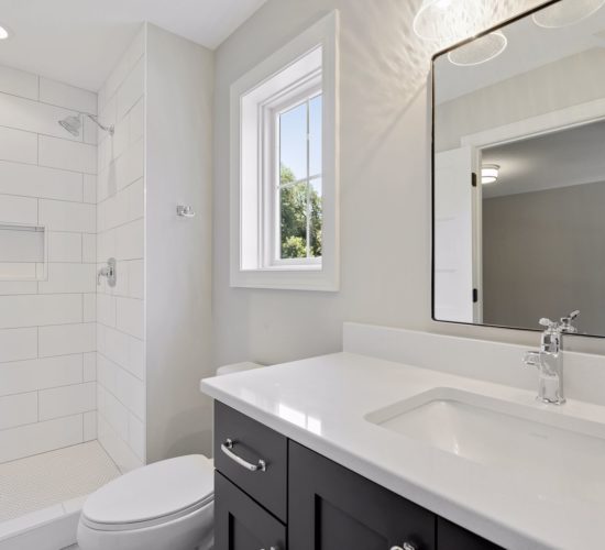 bathroom with tiled shower