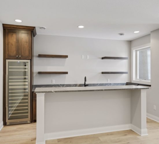 bar with floating shelves and island