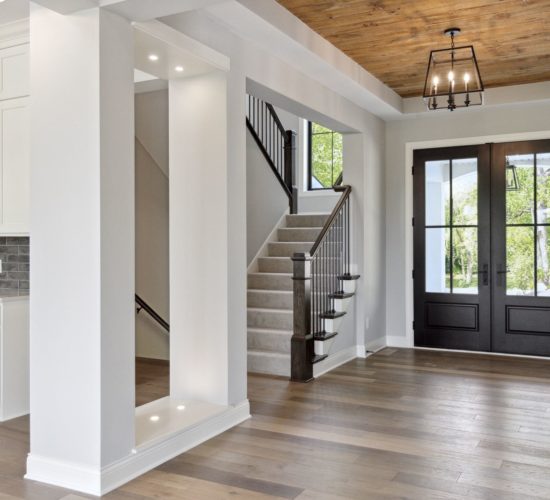 home entry with wood beamed ceiling