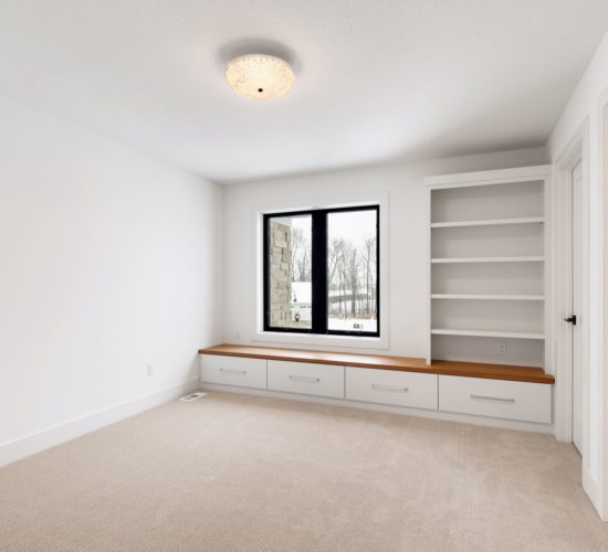 bedroom with built-ins and window bench