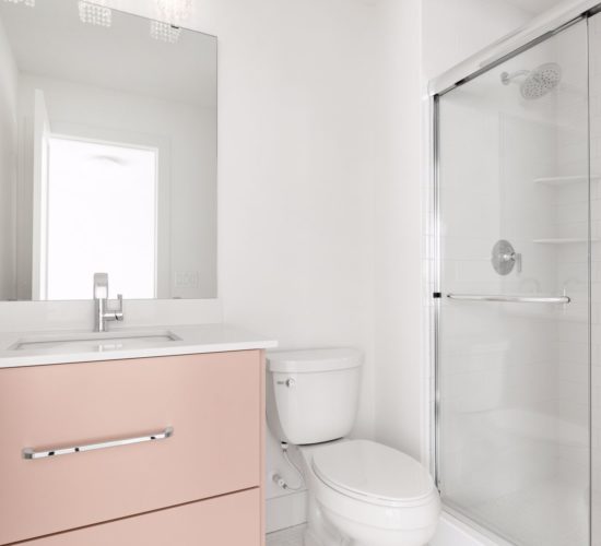 bathroom with pink cabinets