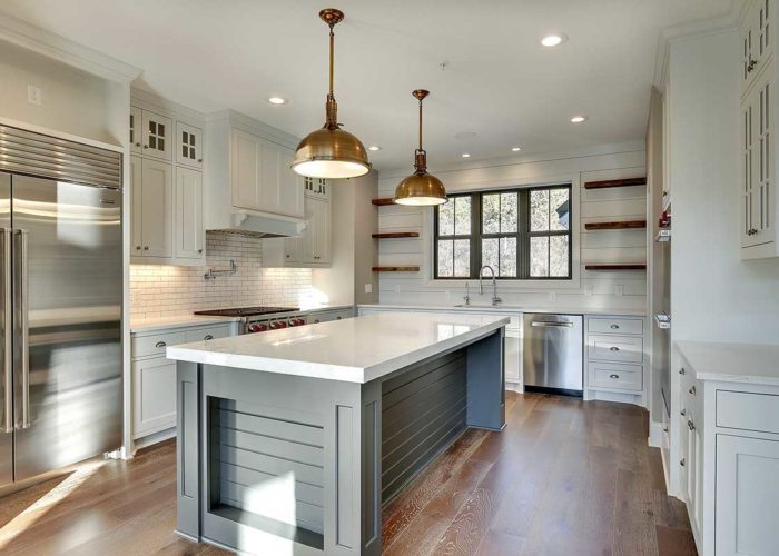 Copper lighting in white kitchen
