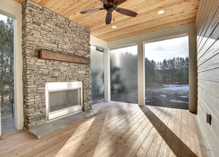 Seasonal porch with full windows and fire place