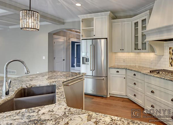 Modern white kitchen with marble countertops